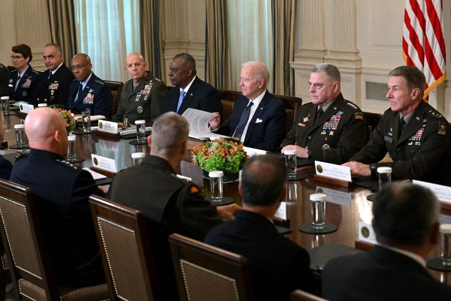 US President Joe Biden (third from right) meets with US Defense Secretary Lloyd Austin (fourth from right), Chairman of the Joint Chiefs of Staff General Mark Milley (second from right), and Department of Defense leaders to discuss national security priorities, in the State Dining Room of the White House in Washington, DC, on 26 October 2022. (Saul Loeb/AFP)