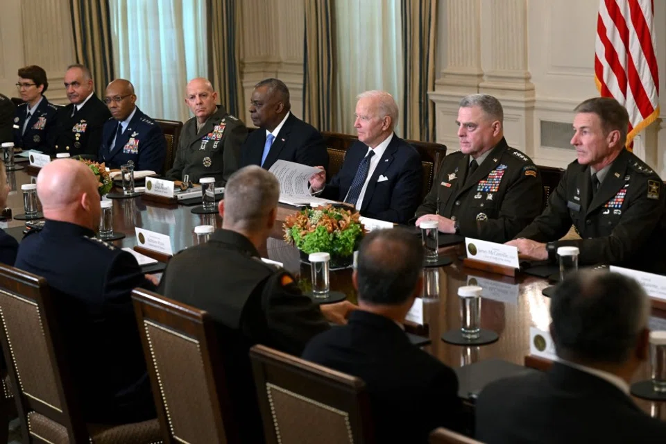 US President Joe Biden (third from right) meets with US Defense Secretary Lloyd Austin (fourth from right), Chairman of the Joint Chiefs of Staff General Mark Milley (second from right), and Department of Defense leaders to discuss national security priorities, in the State Dining Room of the White House in Washington, DC, on 26 October 2022. (Saul Loeb/AFP)