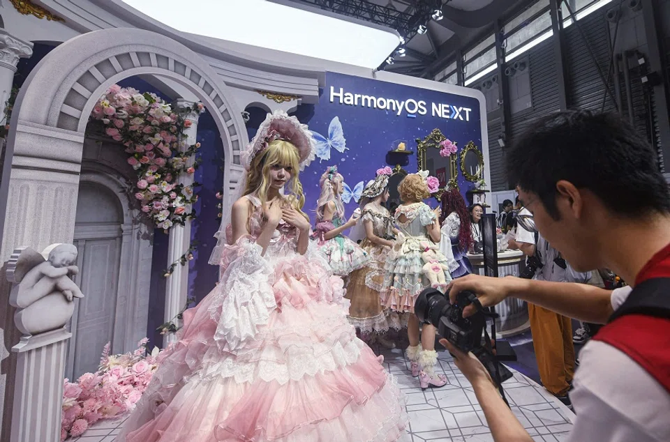 A cosplayer poses for photos at the booth of HarmonyOS during the annual China Digital Entertainment Expo and Conference, also known as ChinaJoy, in Shanghai, China, on 26 July 2024. (AFP)