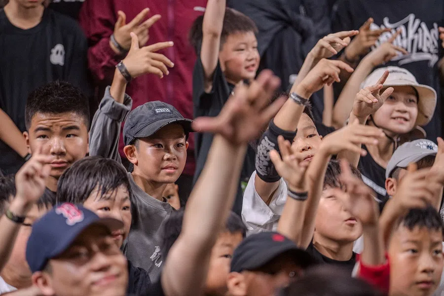 Niu Yiming took a photo with other contestants at an underground breaking competition in Beijing on 28 June 2024.