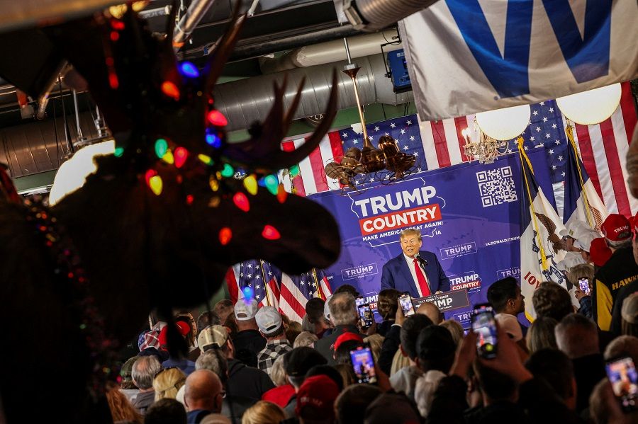 Former US President and Republican presidential candidate Donald Trump rallies with supporters at a "commit to caucus" event at a Whiskey bar in Ankeny, Iowa, US, on 2 December 2023. (Carlos Barria/Reuters)