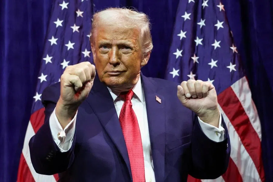 US President Donald Trump gestures as he addresses House Republicans at their annual issues conference retreat, at the Kennedy Center, renamed the Trump-Kennedy Center by the Trump-appointed board of directors, in Washington, DC, US, 6 January 2026.