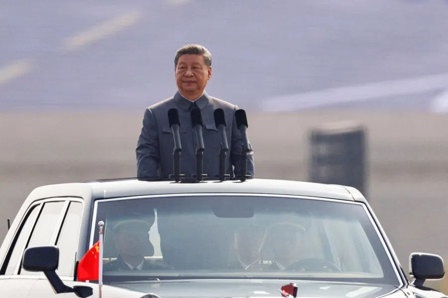 Chinese President Xi Jinping stands in a car to review the troops during a military parade to mark the 80th anniversary of the end of World War II, in Beijing, China, on 3 September 2025.