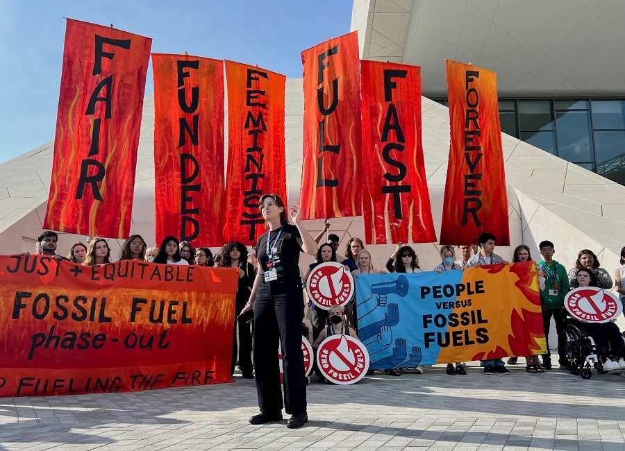 Climate activists protest after a draft of a negotiation deal was released, at the United Nations Climate Change Conference COP28 in Dubai, United Arab Emirates, on 13 December 2023. (Rula Rouhana/Reuters)