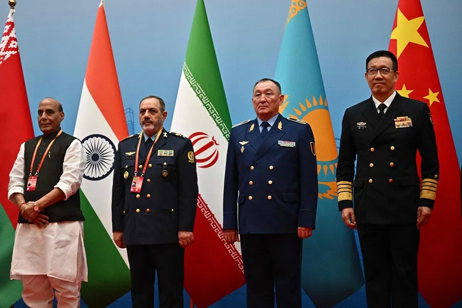 (L-R) India’s Defence Minister Rajnath Singh, Iran’s Defence Minister Amir Nasirzadeh, Kazakhstan’s Defence Minister Dauren Kossanov and China’s Defence Minister Dong Jun gather for a group photo during the Defence Ministers’ Meeting of the Shanghai Cooperation Organisation (SCO) Member States in Qingdao, in eastern China’s Shandong province on 26 June 2025. (Pedro Pardo/AFP)