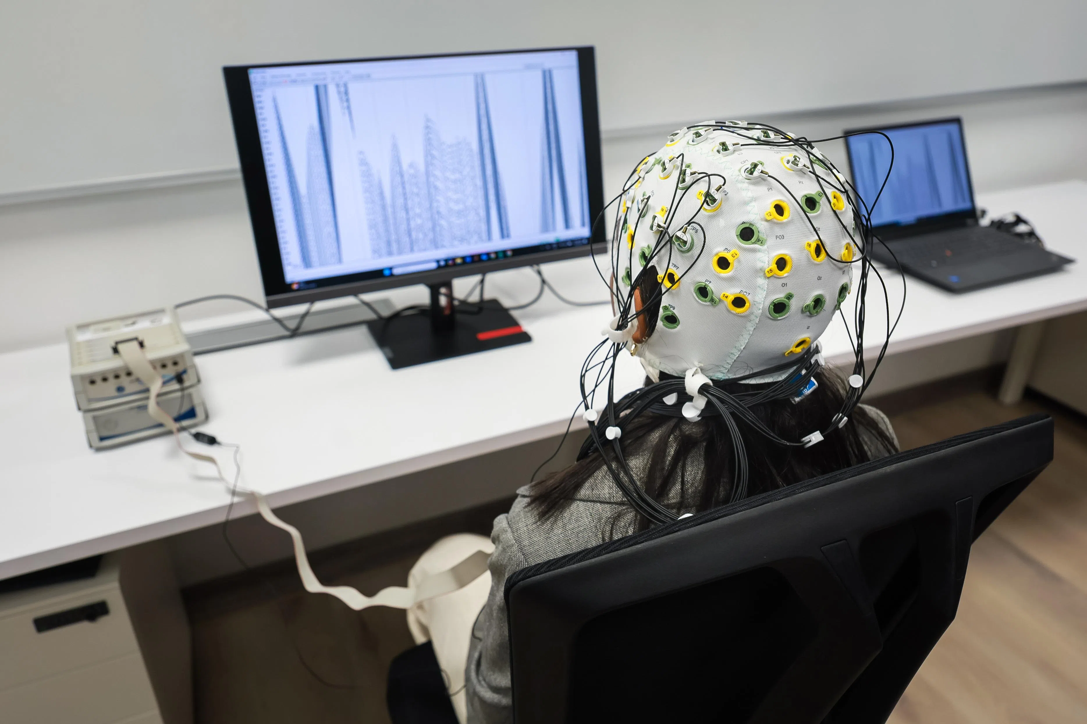 A Singapore Institute of Technology student demonstrating the use of a BCI in a lab at Singapore Institute of Technology's Punggol Campus on 3 September 2025.
