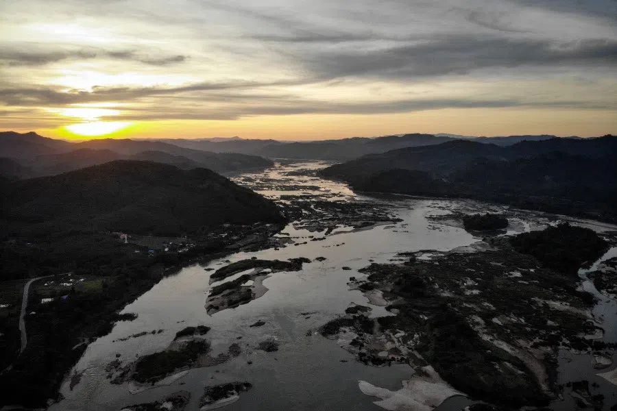 The Mekong River at Sangkhom district in the northeastern Thai province of Nong Khai, with Laos seen on the right. The once mighty Mekong River has been reduced to a thin, grubby neck of water across Northern Thailand - record lows blamed on drought and a recently opened dam hundreds of kilometers upstream. (Lillian Suwanrumpha/AFP)