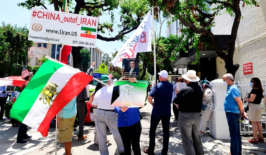 Iranian-Americans protest China's bypassing of US sanctions in doing business with Iran, as well as what they believe as the handing over of Kish island in the Persian Gulf to China in exchange for military, regional and international support, in front of the Chinese Consulate in Los Angeles, California on 10 July 2020. (Frederic J. Brown/AFP)