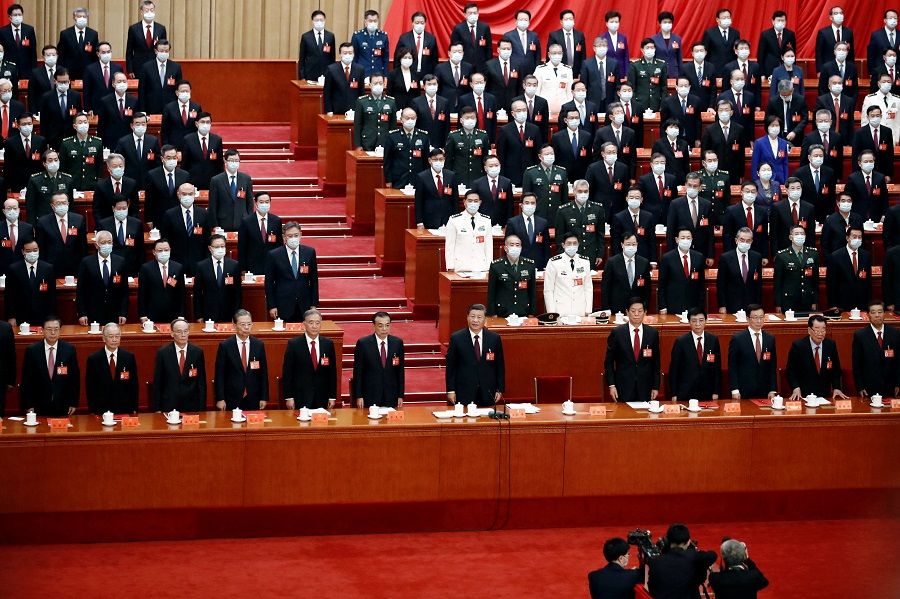 Chinese President Xi Jinping and other officials attend the closing ceremony of the 20th Party Congress of the Communist Party of China, at the Great Hall of the People in Beijing, China, 22 October 2022. (Tingshu Wang/Reuters)