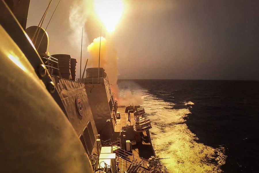This handout picture courtesy of the US Navy taken on 19 October 2023 shows the Arleigh Burke-class guided-missile destroyer USS Carney (DDG 64) defeating a combination of Houthi missiles and unmanned aerial vehicles in the Red Sea. (Mass Communication Specialist 2nd Class Aaron Lau/US Navy/AFP)