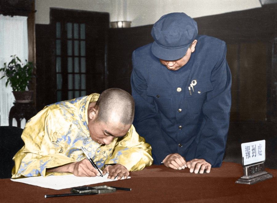 The Panchen Lama signing a document at a Chinese People's Political Consultative Conference (CPPCC) meeting opposing nuclear weapons, December 1954.