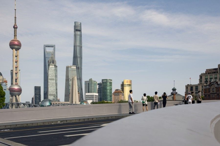Residents stand along a bridge near the Bund in Shanghai, China, on 31 May 2022. (Bloomberg)