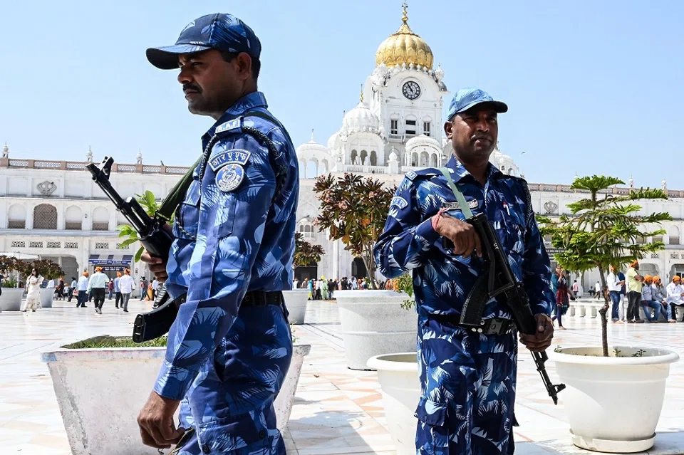 Rapid Action Force (RAF) personnel stand guard outside the Golden Temple in Amritsar, India, on 14 April 2023. (Narinder Nanu/AFP)