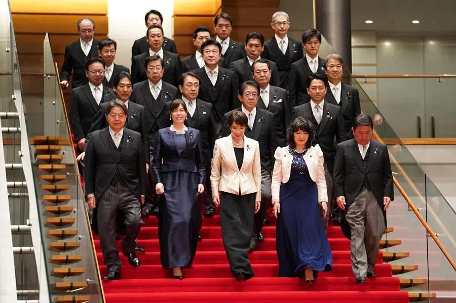 Japanese Prime Minister Sanae Takaichi and members of her new cabinet walk to pose for a group photo at the Prime Minister's Office in Tokyo, Japan, on 18 February 2026. (Kazuhiro Nogi/Pool via Reuters)