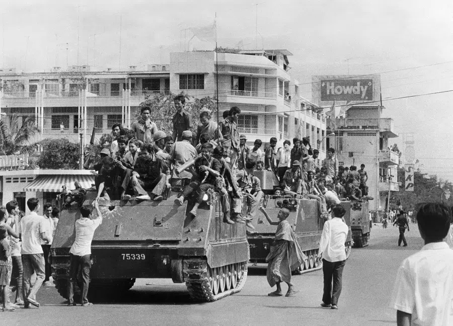Khmer Rouge guerrilla soldiers atop their US-made armoured vehicles enter Phnom Penh on 17 April 1975, the day Cambodia fell under the control of the communist Khmer Rouge forces.