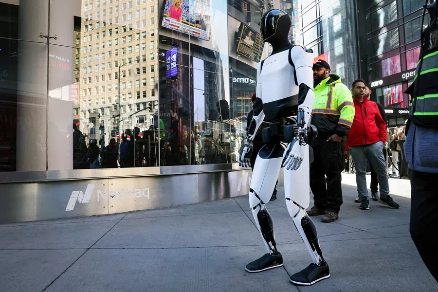 A Tesla Optimus robot walks during an appearance outside the Nasdaq Market site in New York City, US, on 27 October 2025. (Brendan McDermid/Reuters)