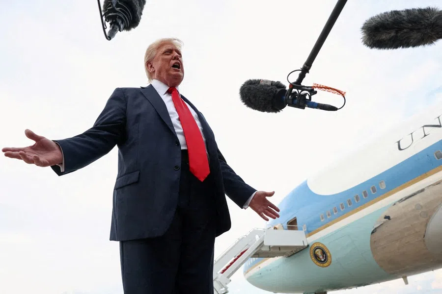 US President Donald Trump speaks with the media after attending the FIFA Club World Cup final, upon his arrival at Joint Base Andrews, Maryland, US, on 13 July 2025.