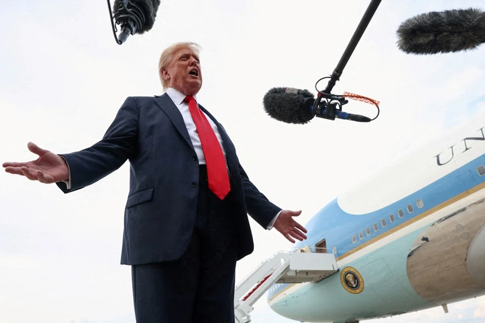 US President Donald Trump speaks with the media after attending the FIFA Club World Cup final, upon his arrival at Joint Base Andrews, Maryland, US, on 13 July 2025. (Kevin Lamarque/Reuters)
