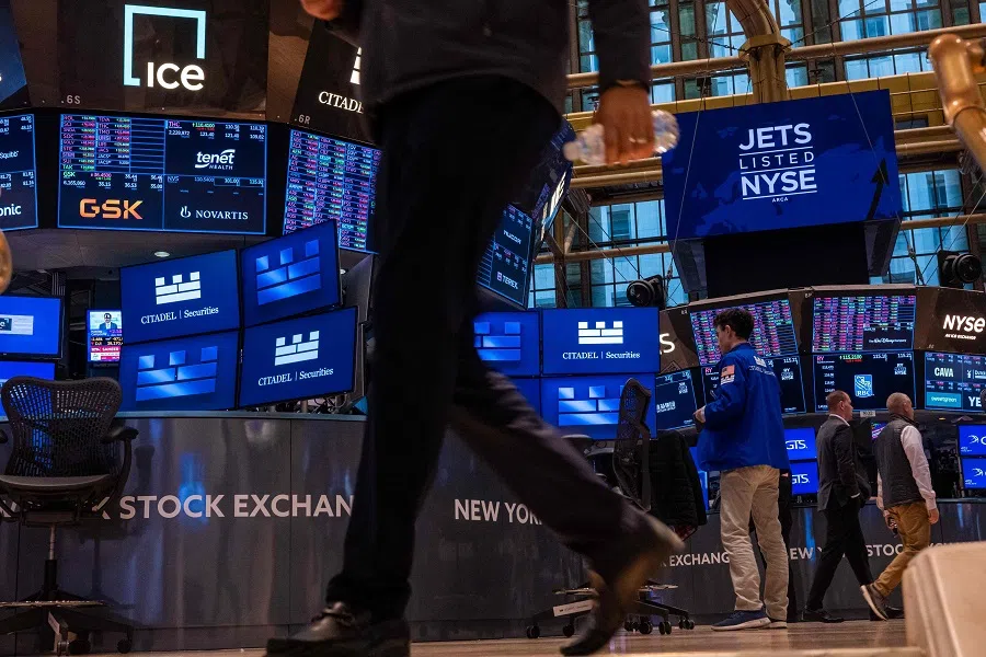 Traders work on the floor of the New York Stock Exchange (NYSE) on 21 April 2025 in New York City, US. (Spencer Platt/Getty Images/AFP)