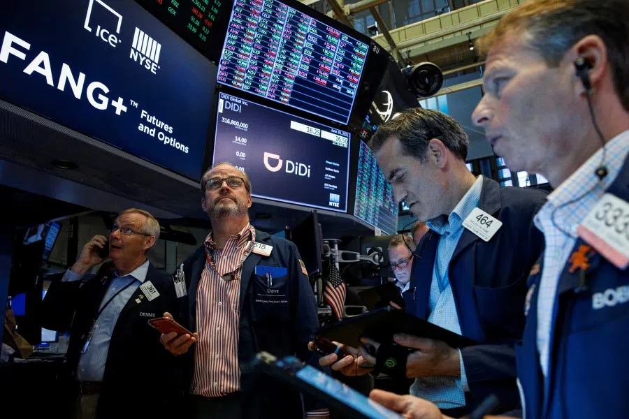 Traders work during the IPO for Chinese ride-hailing company Didi Global Inc. on the New York Stock Exchange (NYSE) floor in New York City, US, 30 June 2021. (Brendan McDermid/Reuters)