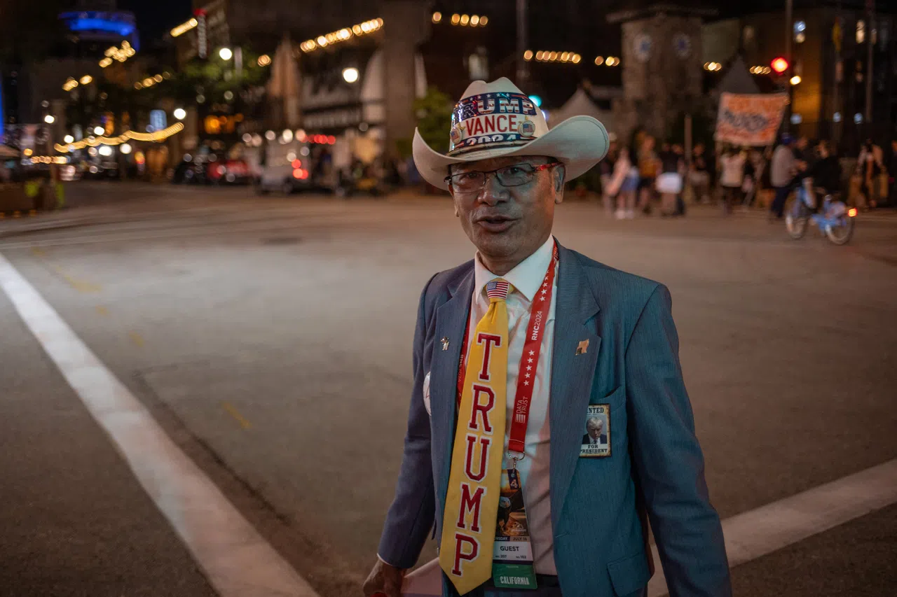 A Vietnamese-American supporter of Donald Trump walks out of Fiserv Forum after the Republican National Convention in Milwaukee, Wisconsin, US, on 19 July 2024. (Adrees Latif/Reuters)