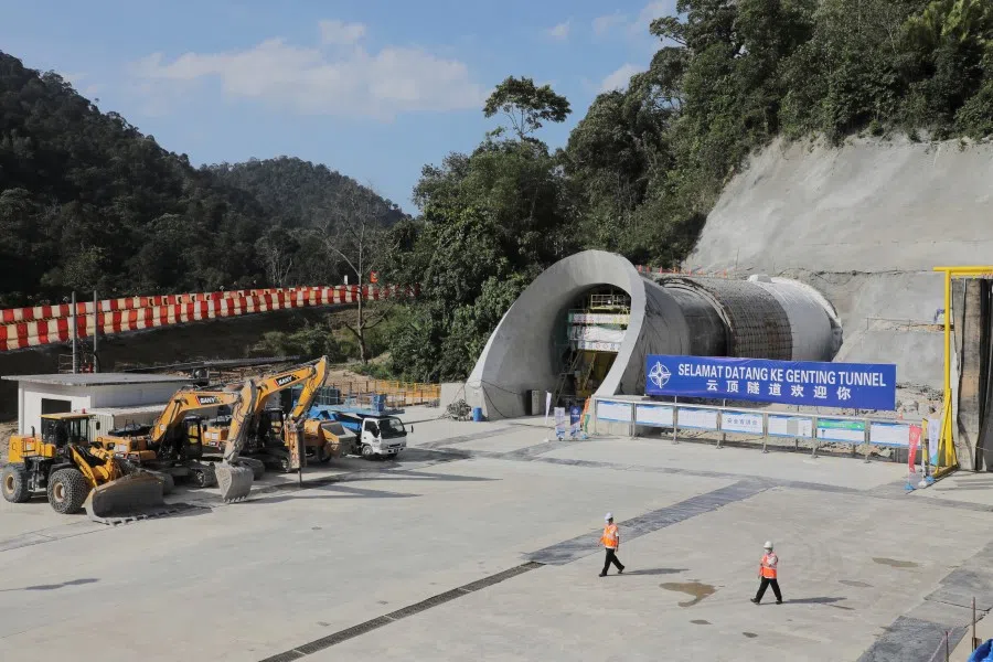 Workers walk at the construction site of East Coast Rail Link (ECRL), a Chinese-invested railway project, part of the Beijing 'Belt and Road Initiative', in Bentong, Malaysia, 13 January 2022. (Hasnoor Hussain/Reuters)