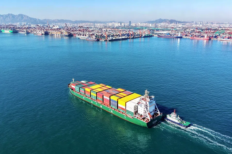 A cargo ship sails into the port in Qingdao in China's eastern Shandong province on 3 November 2025. (AFP)