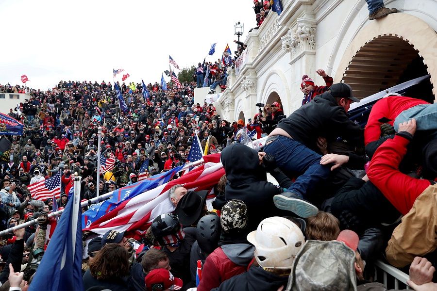 Pro-Trump protesters storm into the US Capitol during clashes with the police, during a rally to contest the certification of the 2020 US presidential election results by the US Congress, in Washington, US, 6 January 2021. (Shannon Stapleton/File Photo/Reuters)