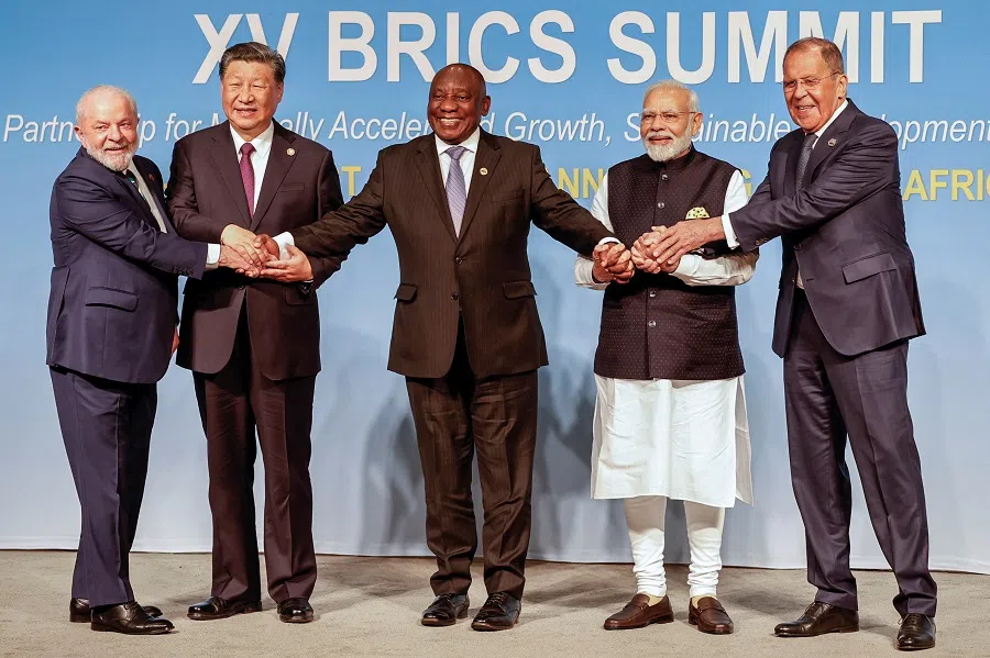 President of Brazil Luiz Inacio Lula da Silva, President of China Xi Jinping, South African President Cyril Ramaphosa, Prime Minister of India Narendra Modi and Russia's Foreign Minister Sergei Lavrov pose for a BRICS family photo during the 2023 BRICS summit at the Sandton Convention Centre in Johannesburg, South Africa, on 23 August 2023. (Gianluigi Guercia/Reuters)