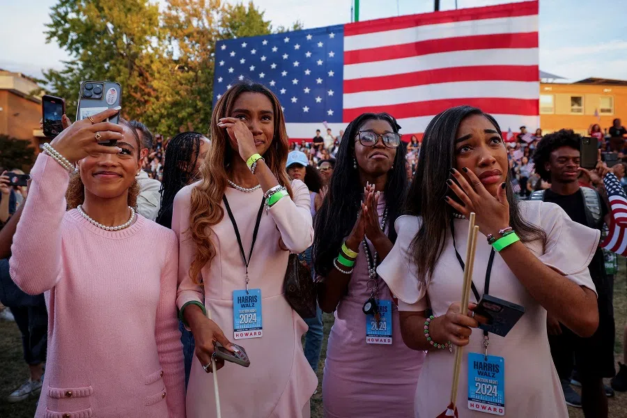 Supporters react while another takes a selfie as Democratic presidential nominee Kamala Harris delivers remarks, conceding the 2024 US presidential election to President-elect Donald Trump, at Howard University in Washington, US, on 6 November 2024. (Kevin Mohatt/Reuters)