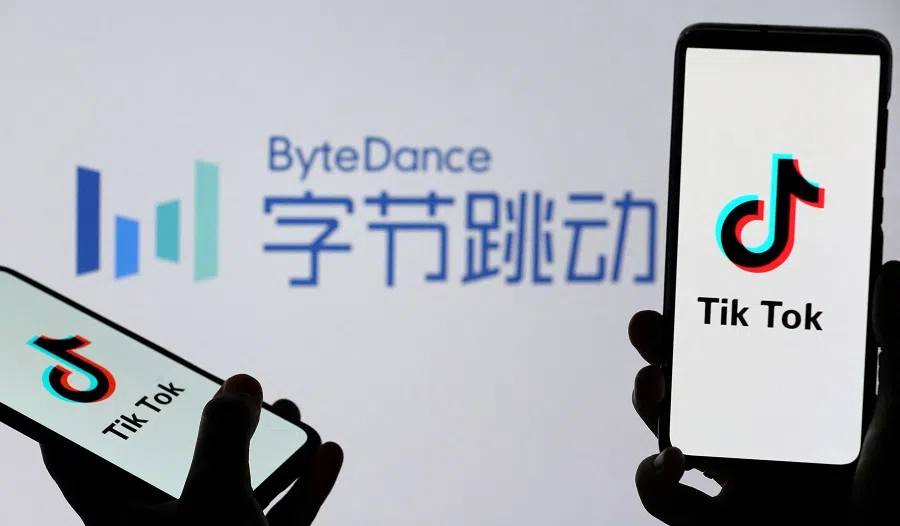 Tik Tok logos are seen on smartphones in front of a displayed ByteDance logo in this illustration taken on 27 November 2019. (Dado Ruvic/Illustration/Reuters)