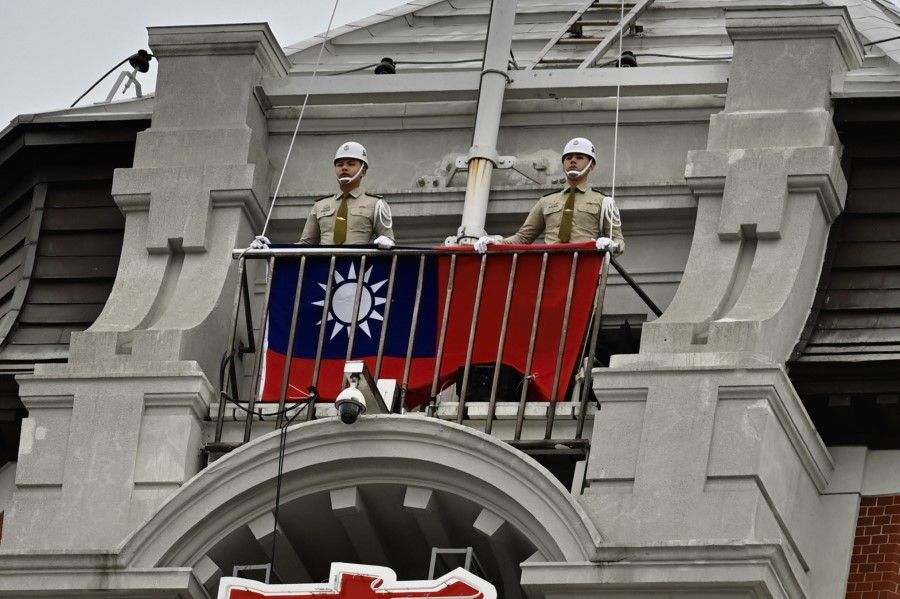 Taiwan's military police prepare to raise the national flag during a ceremony to mark the Taiwan National Day at the Presidential Office in Taipei on 10 October 2020. (Sam Yeh/AFP)