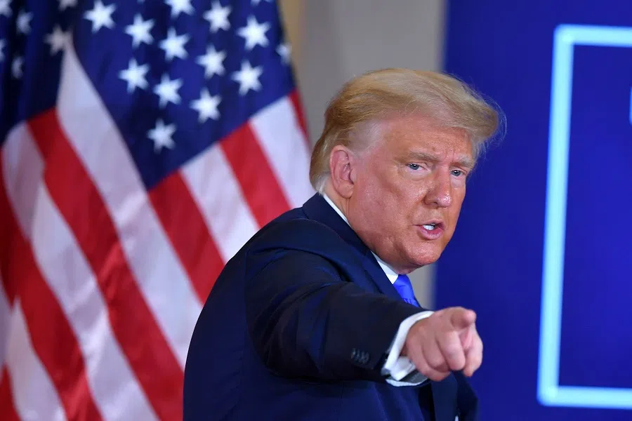 US President Donald Trump gestures after speaking during election night in the East Room of the White House in Washington, DC, early on 4 November 2020. (Mandel Ngan/AFP)