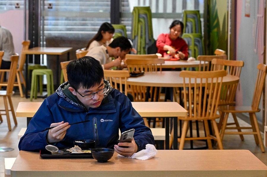 Diners eat in a restaurant in Guangzhou's Tianhe district in Guangdong province, China, on 1 December 2022, following the easing of Covid-19 restrictions in the city. (CNS/AFP)