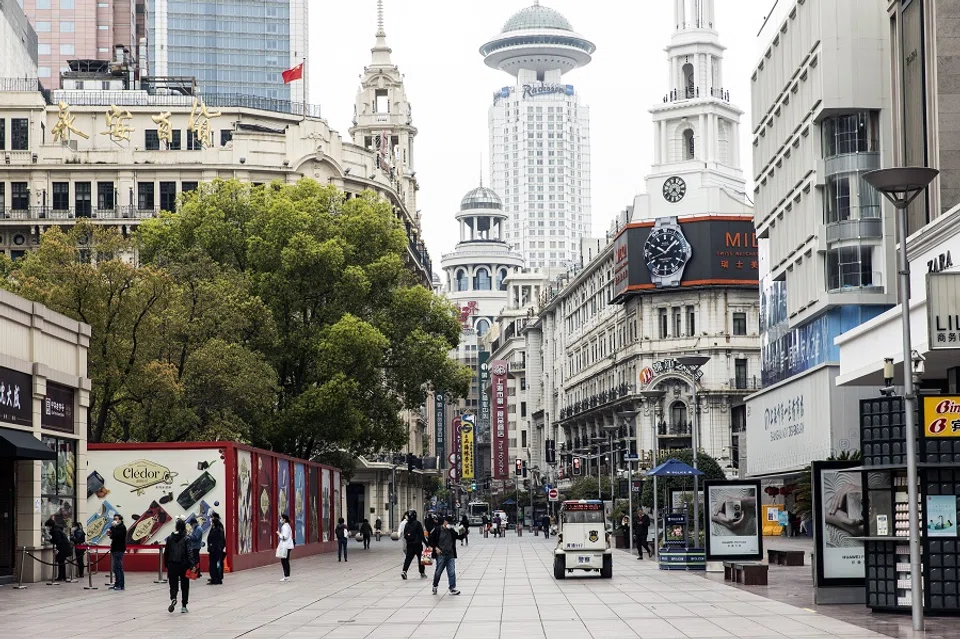 Pedestrians along the near-empty Nanjing Road shopping street outside of the impacted areas during a lockdown due to Covid-19 in Shanghai, China, on 31 March 2022. (Qilai Shen/Bloomberg)