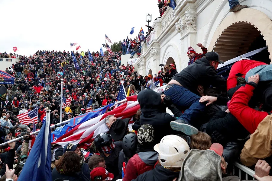 Pro-Trump protesters storm into the U.S. Capitol during clashes with police, during a rally to contest the certification of the 2020 US presidential election results by the US Congress, in Washington, US, on 6 January 2021. (Shannon Stapleton/Reuters)
