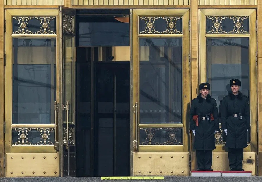 Security officers stand guard at the entrance to the Great Hall of the People ahead of the annual meeting of the National People's Congress, which starts this week, in Beijing, China, on 2 March 2026.