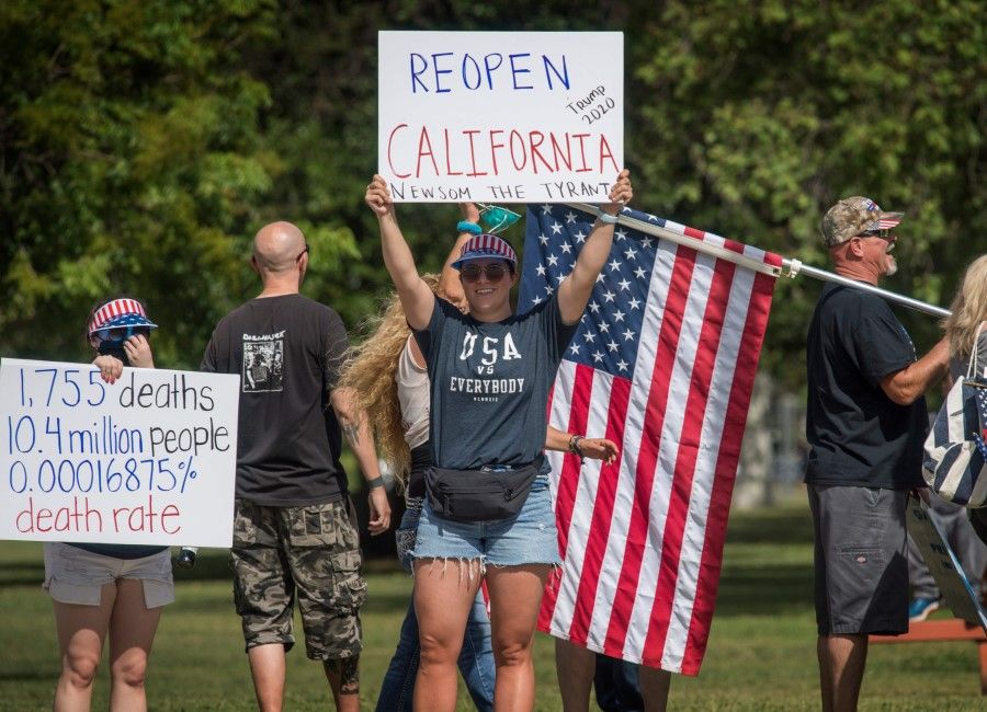 Protesters call for the reopening of the California economy after the lockdown closure in California, 16 May 2020. (Mark Ralston/AFP)