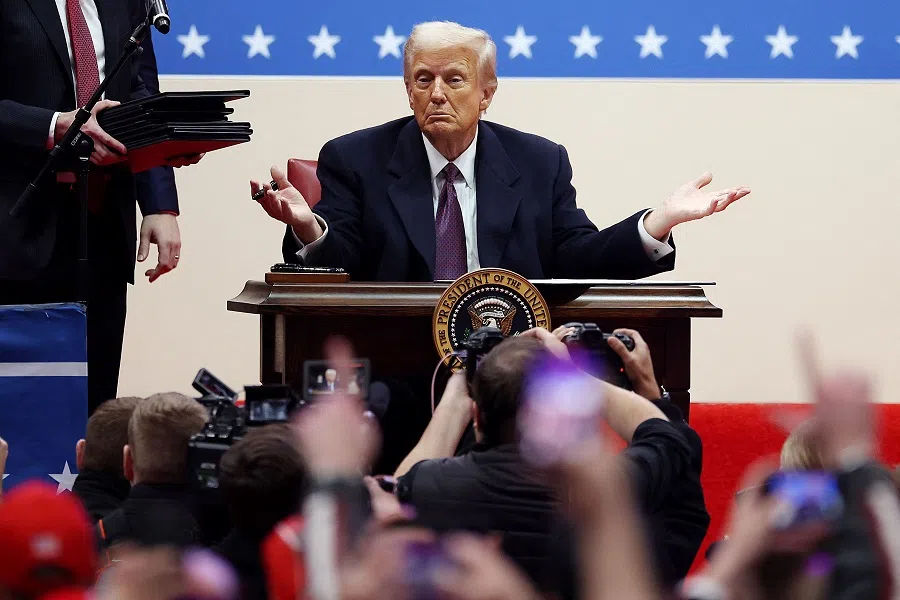 US President Donald Trump gestures after signing executive orders during an indoor inauguration parade at Capital One Arena on 20 January 2025 in Washington, DC, US.