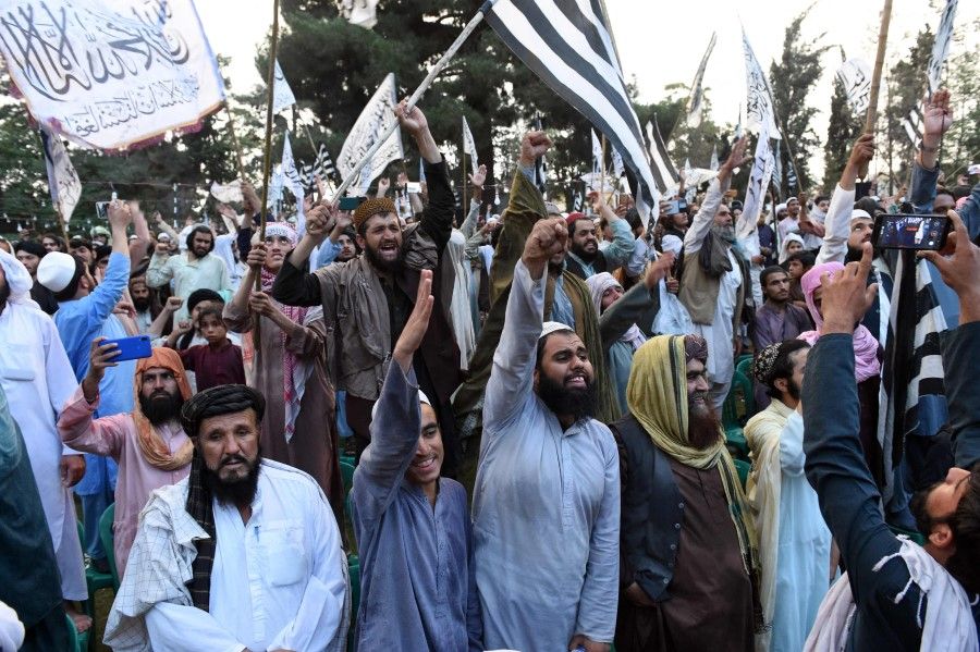 Activists of Jamiat Ulema-e-Islam Nazaryati, a religious political party in Pakistan, shout slogans during a pro-Taliban meeting in Quetta on 30 September 2021. (Banaras Khan/AFP)