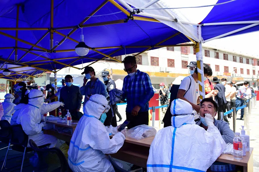Residents line up to take a nucleic acid test during a mass testing following a Covid-19 outbreak in Lhasa, Tibet Autonomous Region, China, 9 August 2022. (CNS photos via Reuters)