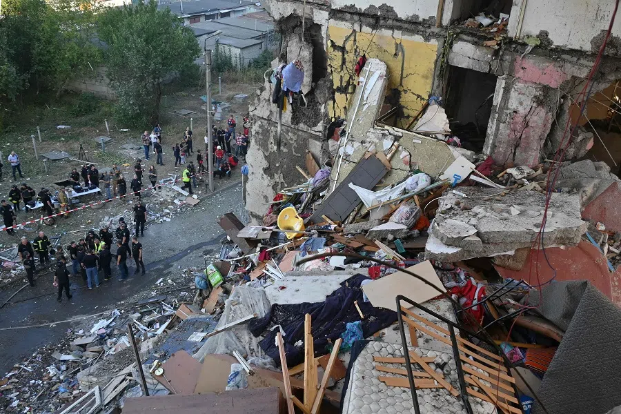 This photograph shows the remains of an apartment building destroyed during an airstrike in Kharkiv, Ukraine, 24 September 2024, amid the Russian invasion of Ukraine. (Sergey Bobok/AFP)