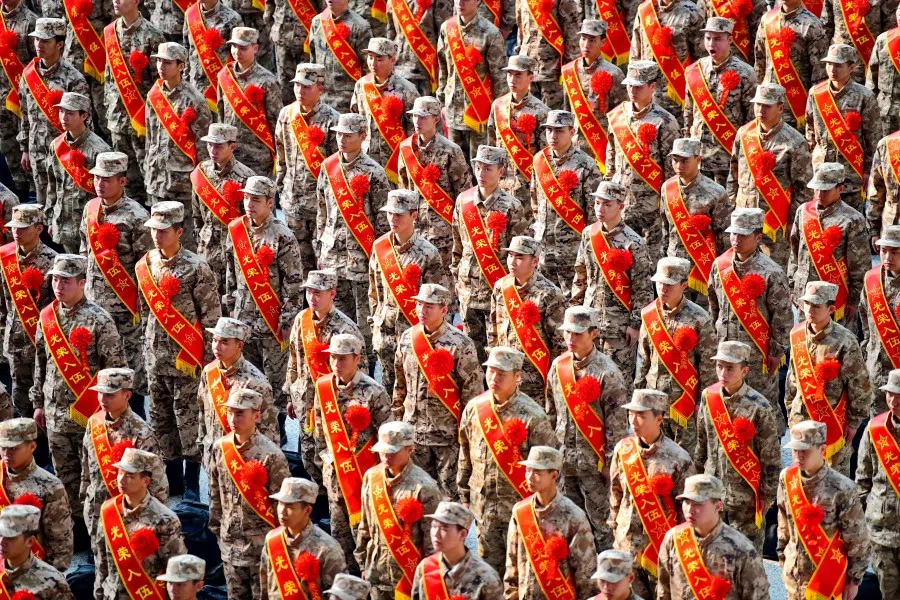 New recruits of the Chinese People's Liberation Army (PLA) attend a send-off ceremony at a railway station in Ganzhou, Jiangxi province, China, 16 March 2023. (China Daily via Reuters)