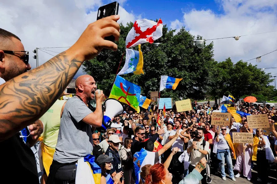 People protest during a demonstration against illegal immigration in the Canary Islands, in Santa Cruz de Tenerife, Spain, on 27 October 2024. (Borja Suarez/Reuters)