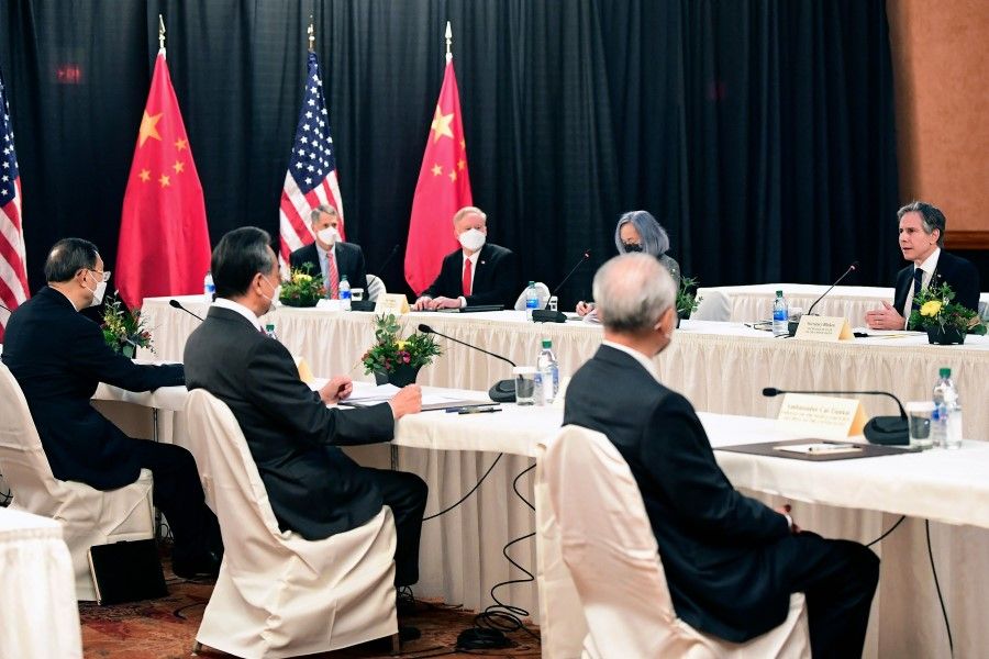 US Secretary of State Antony Blinken (right) speaks while facing China's Director of the Office of the Central Commission for Foreign Affairs Yang Jiechi (left), and Chinese Foreign Minister Wang Yi (second from left), at the opening session of US-China talks at the Captain Cook Hotel in Anchorage, Alaska on 18 March 2021. (Frederic J. Brown/AFP)