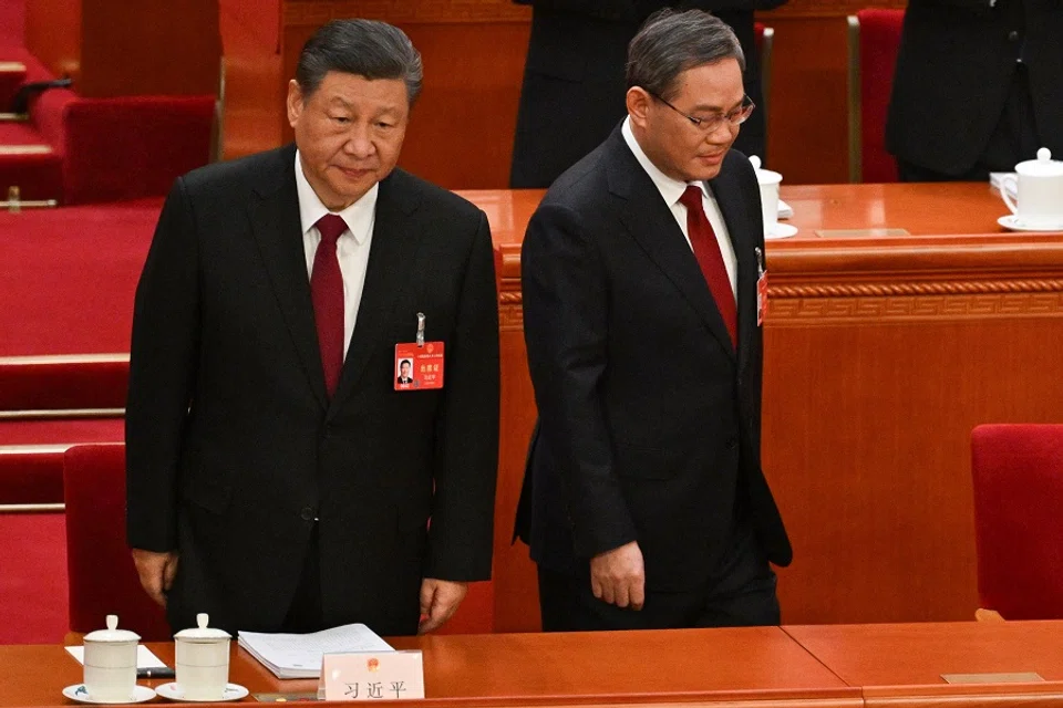 Chinese President Xi Jinping (left) and Premier Li Qiang arrive for the opening session of the National People's Congress (NPC) at the Great Hall of the People in Beijing on 5 March 2024. (Pedro Pardo/AFP)