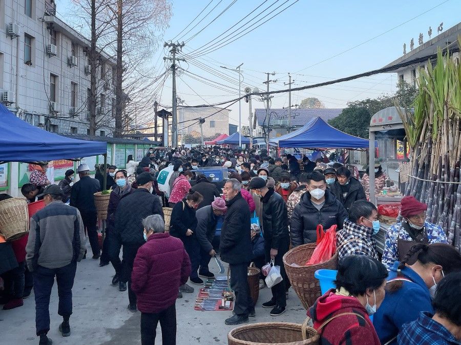 People at the market in Zhangjiajie, 8 January 2023.