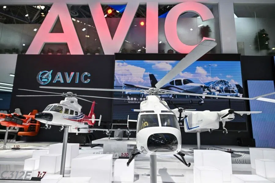 Scale model helicopters are seen in the booth of the Aviation Industry Corporation of China (AVIC) during the Aero Asia 2025 in Zhuhai, in southern China’s Guangdong province on 27 November 2025. (Hector Retamal/AFP)