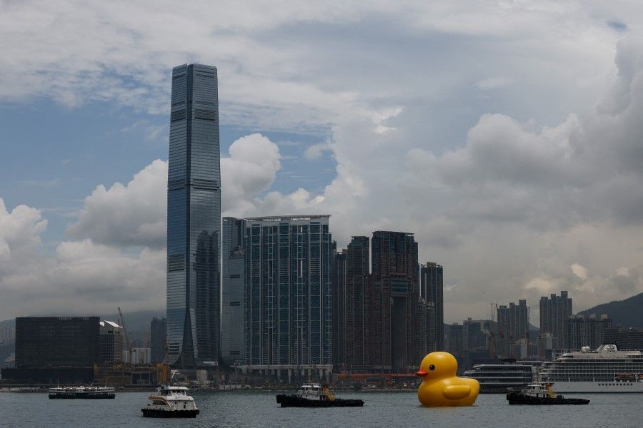 An art installation dubbed "Double Ducks", by Dutch artist Florentijn Hofman, is seen at Victoria Harbour, in Hong Kong, China, 9 June 2023. REUTERS/Tyrone Siu