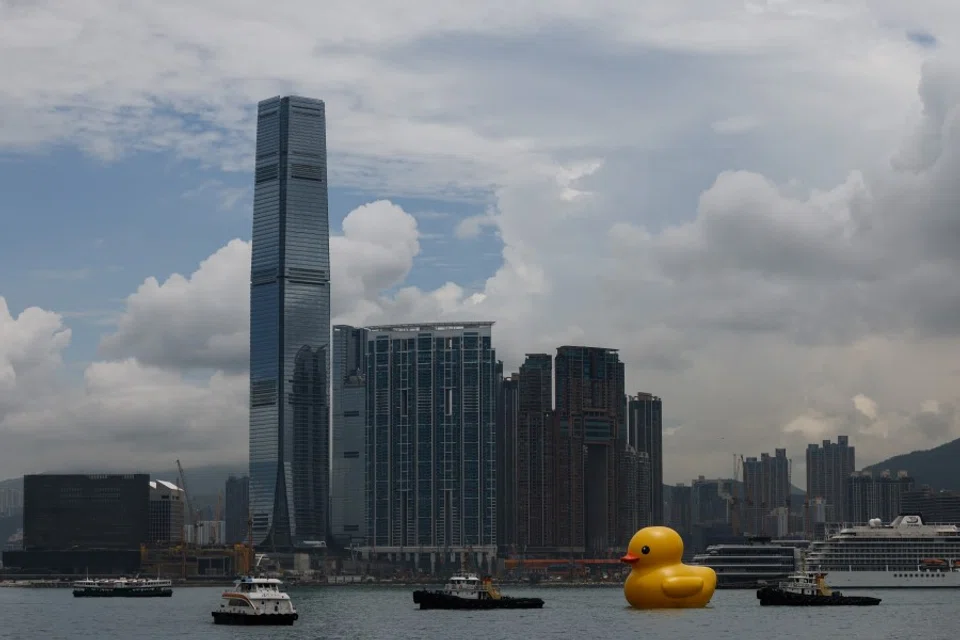 An art installation dubbed "Double Ducks", by Dutch artist Florentijn Hofman, is seen at Victoria Harbour, in Hong Kong, China, 9 June 2023. REUTERS/Tyrone Siu